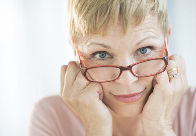 Woman Peering Over Her Eyeglasses